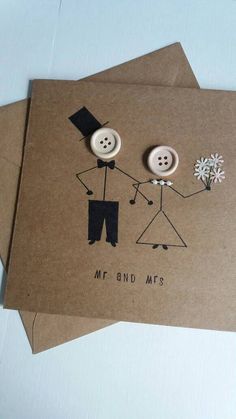 two greeting cards with buttons on them, one is holding the other's hand