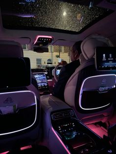 the interior of a car with electronic gadgets and touchscreens on it's dash boards