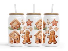 three glass jars with gingerbread cookies and starfish on them, one has a straw in it