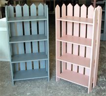 two bookshelves sitting next to each other on the ground