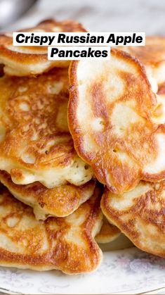 some pancakes are stacked on a plate and ready to be eaten