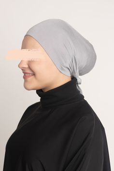 Our Tie-Back Undercaps are made of a cooling cotton jersey blend to hold your hair comfortably and firmly in place. Wear under any hijab to avoid slippage and excessive hair and scalp friction. You may wear the lightweight jersey fabric comfortably all day long. The ample fabric is flexible to fit large-sized buns and long hair completely, while the drawstring tie-back allows you to adjust the under cap to your desired fit. Our Tie-Back Under cap in Sterling, which comes in a traditional warm light grey hue, is an important necessity for every hijab style. Pair it with our Hijabs to complete the look! Hijab Style, Tie Backs, Tie Back, Warm Light, Jersey Fabric, Light Grey, Long Hair Styles, Hair, How To Wear