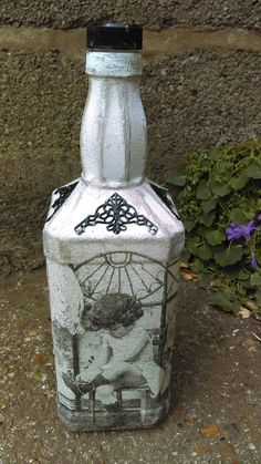 a bottle that is sitting on the ground