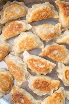 meat pierogi in a pan with text overlay