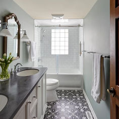 a bathroom with a sink, toilet and bathtub