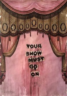 a pink stage curtain with the words your show must go on written in black ink