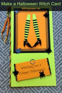 a halloween card made with paper and scissors