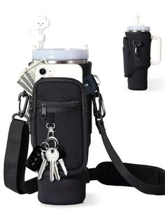 a cell phone in a pouch with keys hanging from it's side and a camera attached to the back