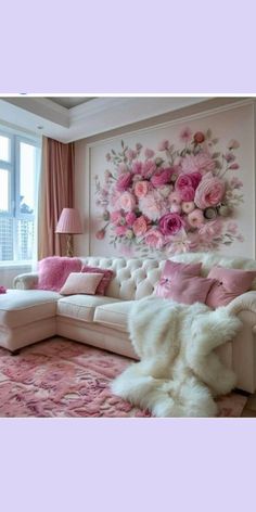 a living room decorated in pink and white with flowers on the wall behind the couch