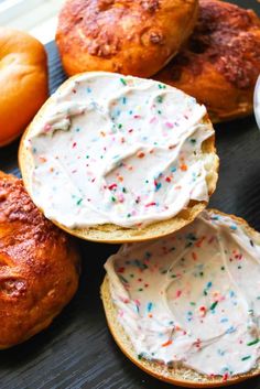 donuts with white frosting and sprinkles on them