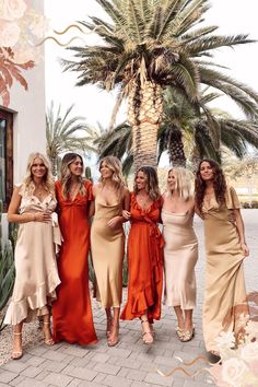 the bridesmaids are all dressed in different styles and colors, posing for a photo