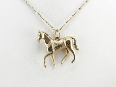 A horse is caught galloping in this sweet vintage charm! The size of this gold piece allows it to be worn on a charm bracelet but is also large enough to wear on a pendant chain. Sweetly designed with a sense of motion and life, this will be a wonderful gift for any equestrian lady. This pendant does not come with the chain shown. Please feel free to contact us, we will help you find the perfect chain for your style and budget! Metal: 14K Yellow Gold Measures: 22 x 22 mm Marks: "14K" Stamped on Cameo Ring, Vintage Horse, Gold Piece, A Horse, Gold Charm, Eternity Bands, Vintage Charms, Charm Pendant, Equestrian