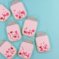 decorated cookies in the shape of mason jars with hearts