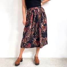 Smart, arty, pleated vintage midi skirt in black, beige brown and red abstract print. It has a beautiful A-line shape and a fitted waist with a front zip fly and two button fastening. It is lined and has one side pocket. The main fabric is smooth and soft viscose. Fun, classy vintage skirt perfect for wearing all year round. Made in West Germany. 100% viscose, lined with 100% polyester. Labelled as size 10UK (definitely smaller, more like present day 8UK). Measurements when laid flat are: Waist: Brown Flowy Midi-length Skirt, Red Abstract Art, Classy Vintage, Red Abstract, Vintage Rock, Abstract Art Print, 80s Vintage, Pleated Midi Skirt, West Germany