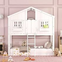 a child's bedroom with pink walls and white bunk beds