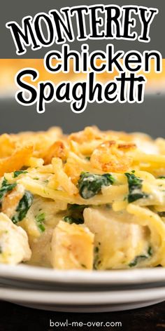 a white plate topped with pasta covered in cheese and spinach