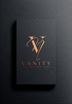 the logo for vanity is shown on a black card with gold foil and an arrow