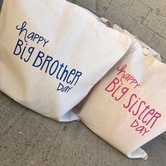 two bags with happy big brother and sister day designs on them sitting next to each other