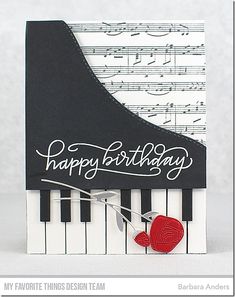 a happy birthday card with a piano and heart