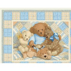 a group of teddy bears sitting on top of a blanket