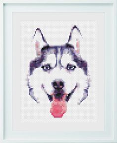 a cross stitch picture of a husky dog's face with its tongue hanging out