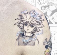 the back of a man's shoulder with an anime character tattoo on it