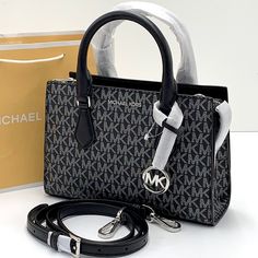 Michael Kors Sheila Small Faux Saffiano Leather Satchel Black/Silver Nwt New With The Tag Authentic Day Or Night, The Sheila Satchel Is Always Chic And Ready To Go. This Faux Saffiano Leather Bag Is Designed In A Structured Silhouette With A Zip Closure For Added Security And A Slip Pocket Inside For Your Cardholder Or Phone. Carry It By The Elegant Top Handle, Or Attach The Included Shoulder Strap To Wear It Crossbody. Satchel Faux Leather 88.92% Coated Canvas/11.08% Polyester Silver-Tone Hardw Michael Kors Handbags Crossbody, High End Handbags, Red Crossbody Bag, Dream Bags, Brown Crossbody Bag, Crossbody Satchel, Leather Satchel Handbags, Michael Kors Crossbody Bag, Brown Leather Handbags