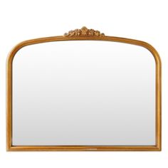 an ornate gold framed mirror against a white background