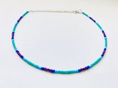 This beautiful beaded necklace is made with glass seed beads that fade from turquoise to blue to purple.  It comes in four different sizes - (14, 16, 18, and 20 inches) and every necklace also comes with three additional inches of extender chain.  This cool colors minimalist necklace goes well with so many outfits and also makes a great gift! Adjustable Purple Choker With Colorful Beads, Purple Beaded Choker With Round Beads, Purple Colorful Beads Choker Jewelry, Purple Colorful Beaded Choker Jewelry, Purple Beaded Choker Jewelry, Purple Choker With Colorful Beads For Gift, Blue Beaded Choker With Tiny Beads, Blue Choker With Tiny Beads, Blue Choker With Tiny Round Beads