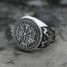 an image of a ring with symbols on it