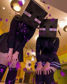 two women dressed up as minecrafts with purple stars on their heads and legs