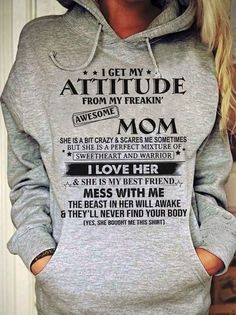 a woman wearing a grey hoodie with the words i get my attitude from her