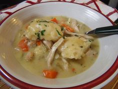 a white bowl filled with chicken and dumplings