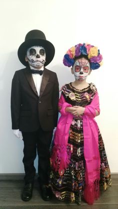 two people in costumes standing next to each other