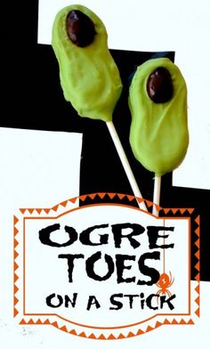 two green lollipops on a stick with the words goree toes on a stick