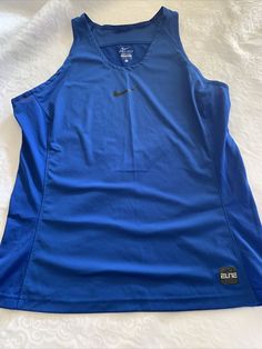 Women’s large Nike Elite dri fit blue basketball tank. Condition is "Pre-owned". Shipped with USPS First Class. Style: 807166-480. Armpit to armpit is 20 inches. Armpit to bottom is a little over 16 inches. In really good condition. Blue Tank Top Sportswear, Team-colored Sleeveless Sports Top, Blue Sleeveless Sportswear Activewear, Blue Sleeveless Tank Top For Gym, Blue Tank Activewear For Training, Blue Tank Top For Training, Blue Sporty Sleeveless Tank Top, Blue Sleeveless Moisture-wicking Activewear, Blue Sleeveless Sports Tank Top