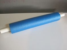 a blue roller sitting on top of a white counter