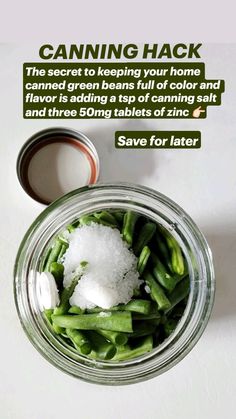 a glass jar filled with green beans and sugar