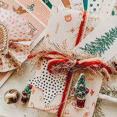 some christmas cards are laying on top of each other