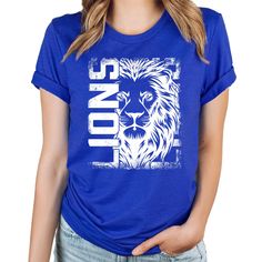 Show your Lion pride with our "Lions" team spirit shirt, available in a variety of striking colors! This shirt is perfect for students, athletes, and teachers who want to represent their school with style. Featuring a bold Lion graphic, this shirt is designed to stand out whether you're on the field, in the classroom, or cheering from the stands.  Why You'll Love It: This Lions shirt isn't just about style--it's about showing your loyalty and pride. Whether you're supporting your team, teaching Cheap Fitted T-shirt For Team Spirit, Lions School Spirit Shirt, School Team Shirts, Team Spirit Shirts, Lion Shirt, Team Mascots, Pride Merch, School Team, Shirts For Teens