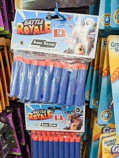 several blue and orange toothbrushes are on display for sale in a toy store