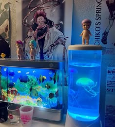 there is a fish tank and some toys on the table