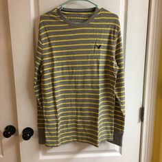 American Eagle Sweater. Size: L. Color: Gray With Yellow Stripes. Condition: Brand New In Package With Tags. Casual Striped Crew Neck Outerwear, American Eagle Sweater, Gray Yellow, Yellow Stripes, Colorful Sweaters, American Eagle Outfitters, American Eagle, Men Sweater, Stripes