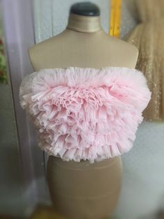 Pink Tulle top Crop top Bridesmaids top Ruffle woman top Wedding top Pink Tube top Evening top Bustie top Birthday outfit Fancy and modern tulle top is a stunning way to make any party full of bright colors and joy. This really stylish bright party top is simply essential for hen parties, bridal showers, weddings, birthday party and other types of gatherings which require colors, cheerful mood and amazing pictures. *High quality tulle Lining: Satin fabric Stretchy desigh Colors: Pink, Blue, Whit Cheap Pink Tops For School Events, Feminine Party Tops With Ruffles, Pink Ruffled Top For Evening, Feminine Pink Strapless Top, Pink Strapless Top With Ruffles, Elegant Pink Top For Wedding, Elegant Pink Wedding Top, Feminine Sleeveless Ruffled Crop Top, Feminine Sleeveless Ruffle Crop Top