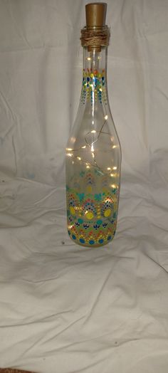 a glass bottle with some lights in it