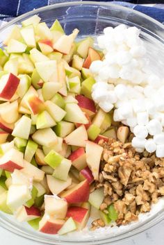 apples, marshmallows, and walnuts in a bowl