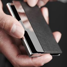 * Holds up to 5 cards
 * Stainless steel 
 * Genuine leather Elegant Black Card Holder As Gift, Elegant Black Bifold Card Holder, Modern Black Formal Card Holder, Elegant Silver Card Holder With Card Slots, Formal Black Card Holder With Card Slots, Modern Formal Card Holder With Card Slots, Modern Black Card Holder For Formal Occasions, Black Card Holder With Interior Slots For Formal Occasions, Black Card Holder With Interior Slots For Formal Use