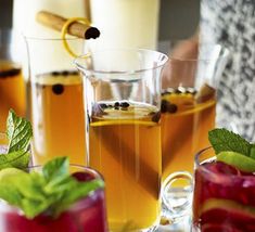 several glasses filled with different types of drinks