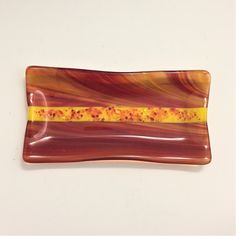 Flaming Orange Yellow Swirls with Yellow abstract Stripe Small Platter Artistic Process, Wavy Edges, Small Platter, Fused Glass Dishes, Glass Ideas, Orange And Yellow, Mug Rug, Glass Dishes, Yellow Stripes