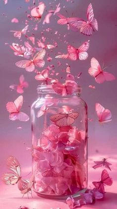 pink butterflies flying out of a glass jar